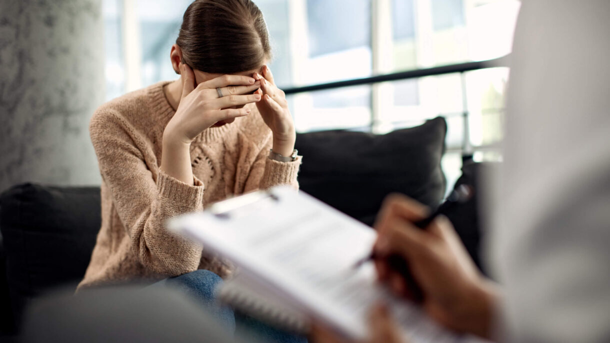 depressed-woman-having-psychotherapy-session-doctor-s-office-scaled (1)